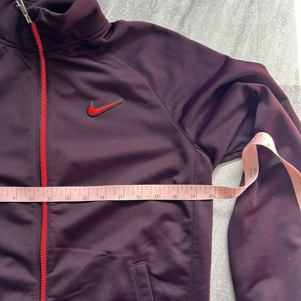 Maroon Nike Jacket size XL Youth black and orange detailing fits womens M/L
